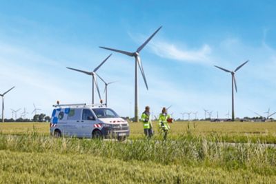 Schleswig-Holstein Netz inspectors at a German wind farm, Consulting & Engineering Services | DXC Technology Customer Story